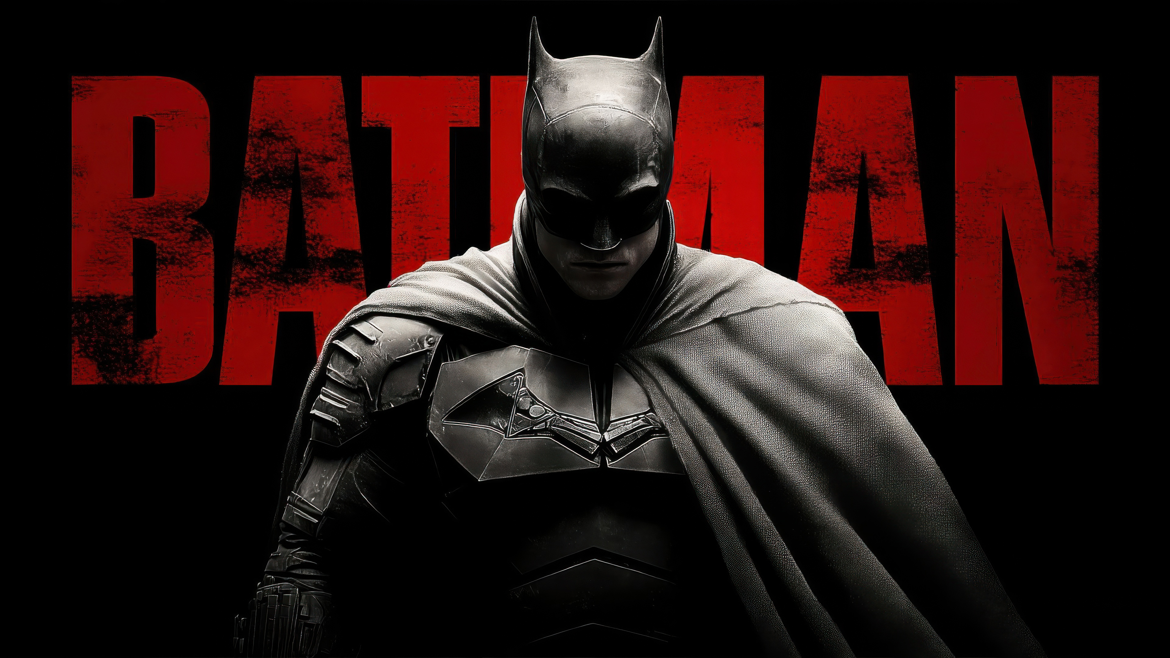 Batman in dark tactical armor stands centered in front of distressed red text spelling BATMAN against a solid black background.