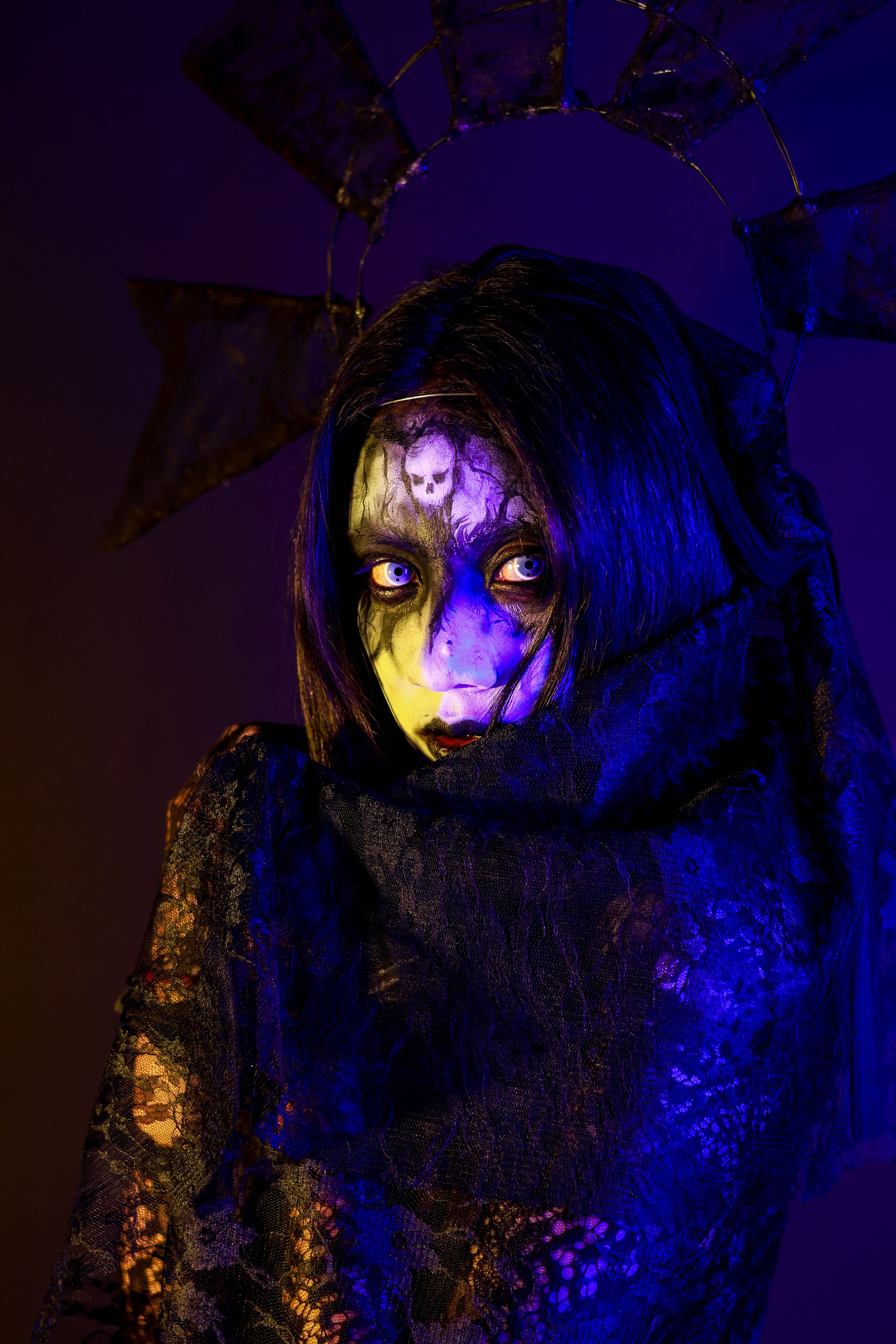 Haunting gothic portrait featuring eerie makeup and dark lighting, creating a my
