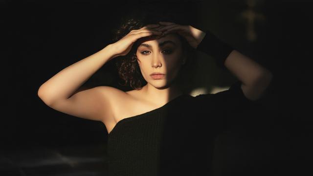 model-in-black-dress-sun-shadow-on-her-face-ux