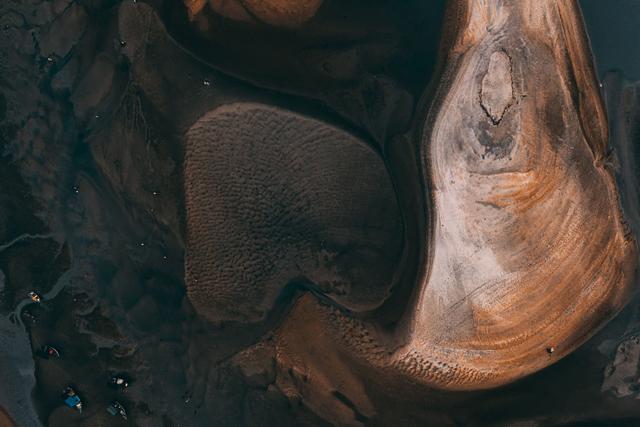 Aerial view showcasing abstract earth patterns with a rich mix of textures and c