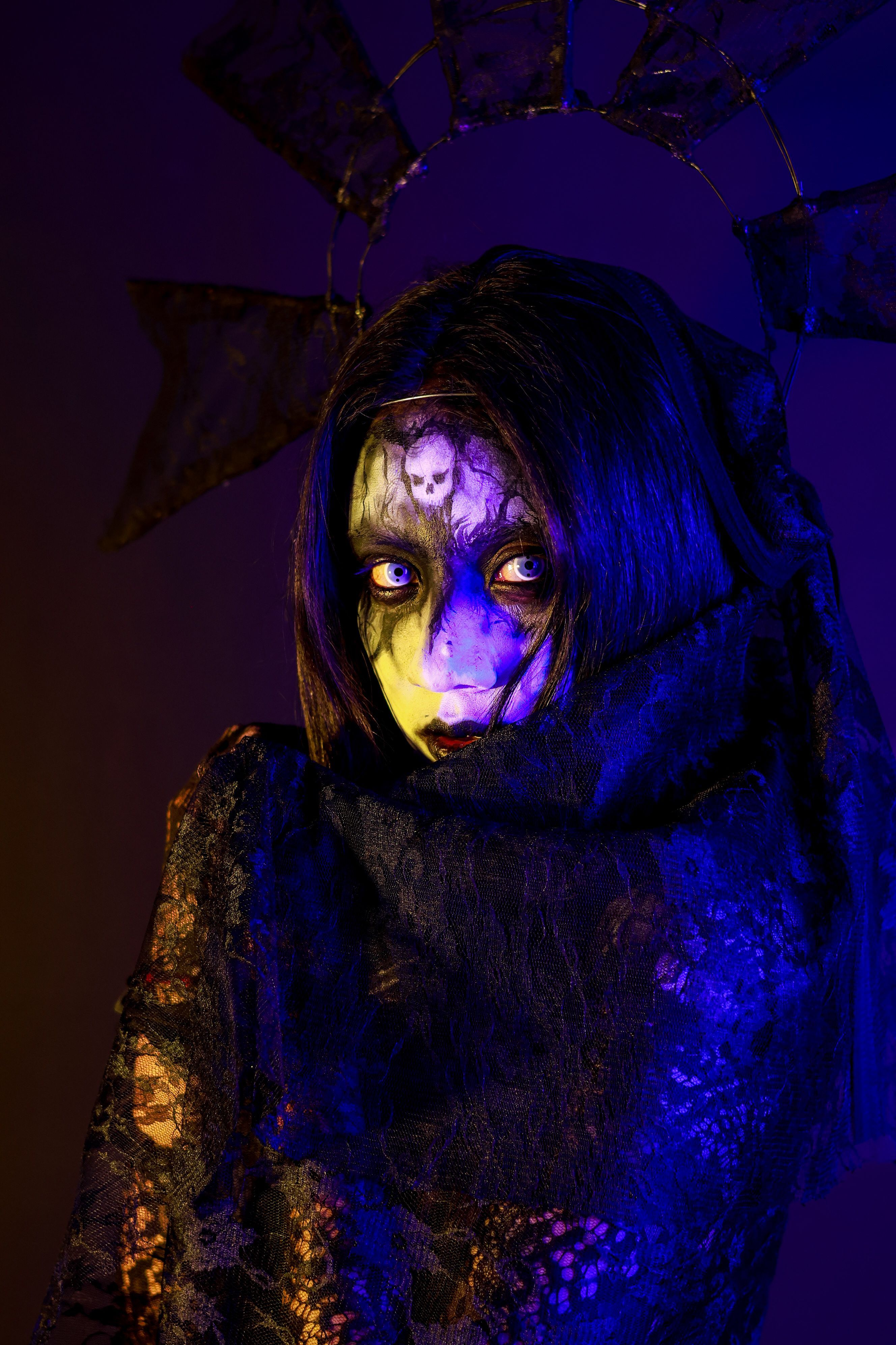 Haunting gothic portrait featuring eerie makeup and dark lighting, creating a my